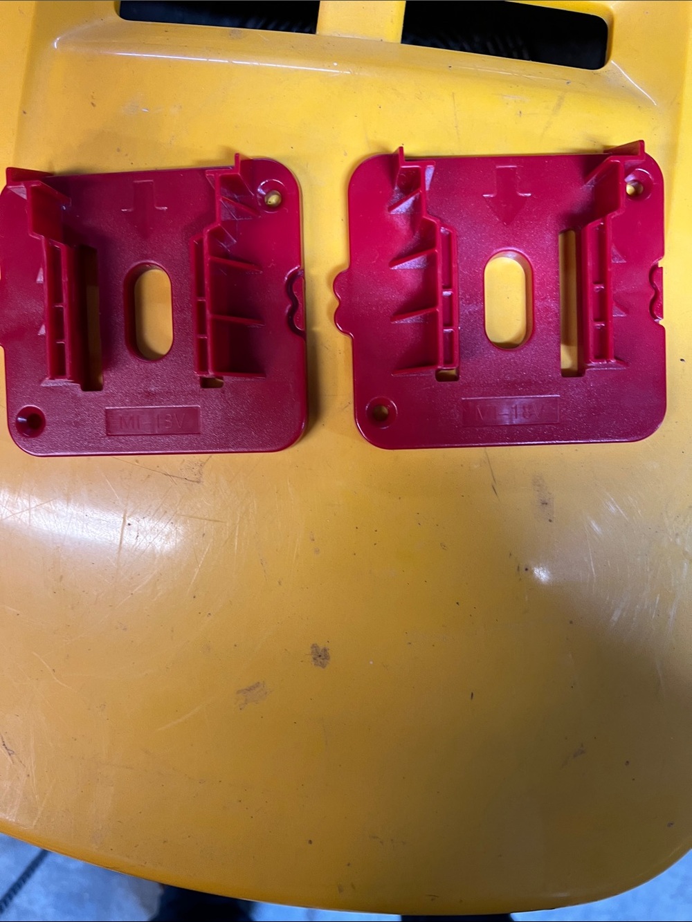 Pair of Red Plastic Milwaukee M 18 battery Mounting Brackets